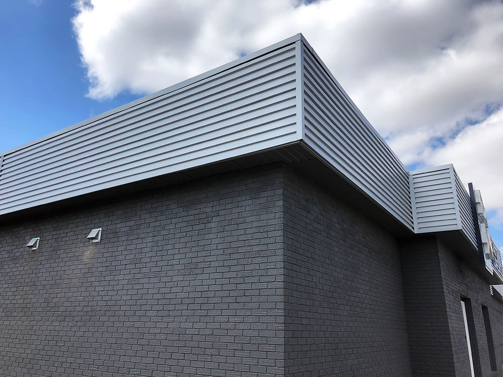 Retail Building with Custom Fascia Accent in Regent Grey
