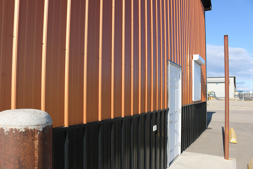 Commercial Shop featuring FC-36 Panel Siding in Copper Penny and Black