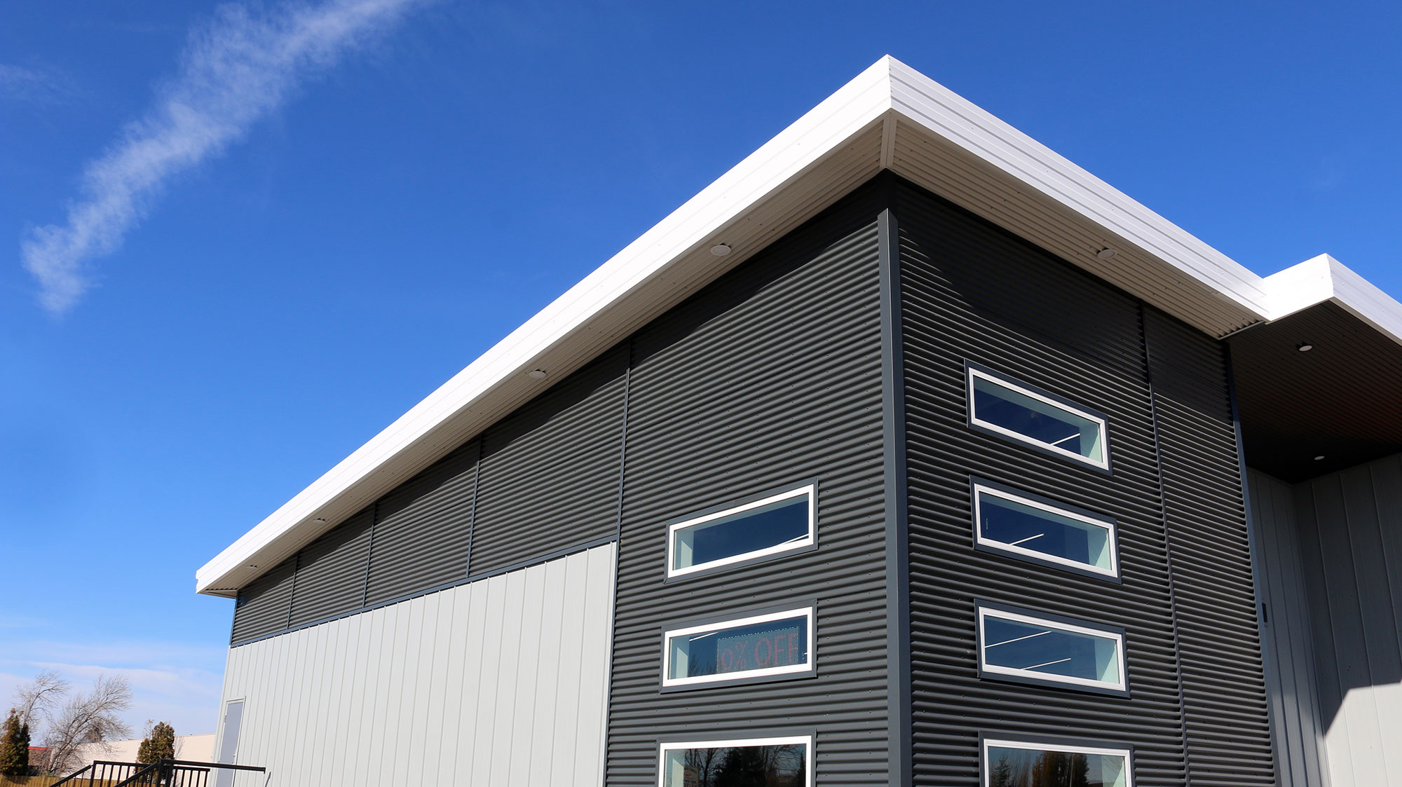 Retail Storefront featuring 7/8 Corrugated Metal Siding and FormaLoc Standing Seam Metal Siding - Forma Steel