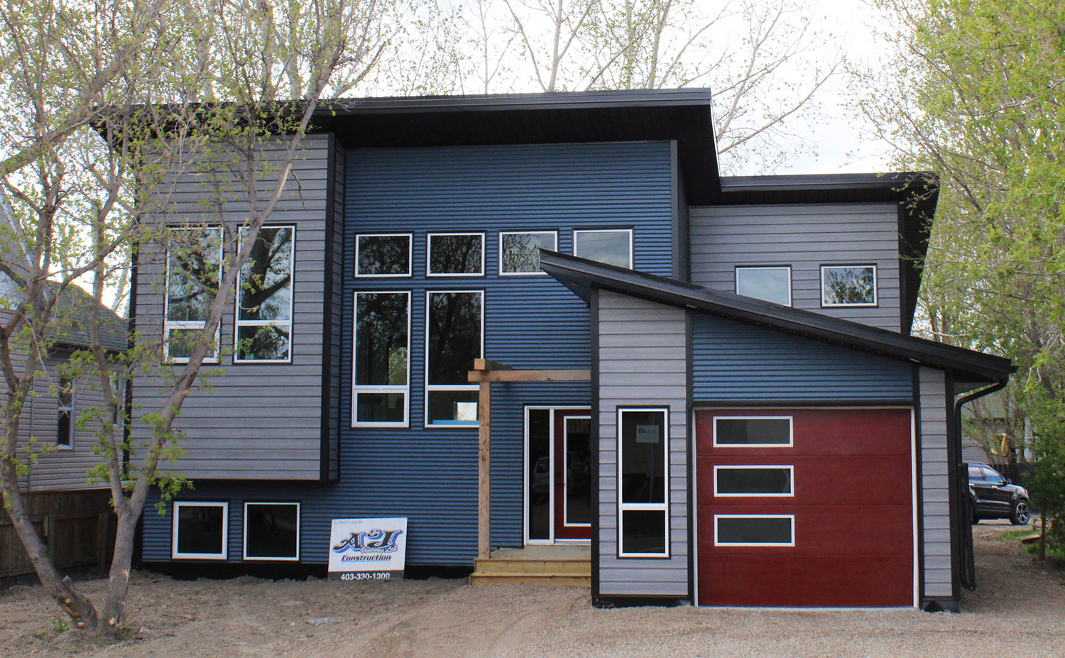 Residential Building with 7/8 Corrugated Oxford Blue Panel and Barnboard Woodgrain