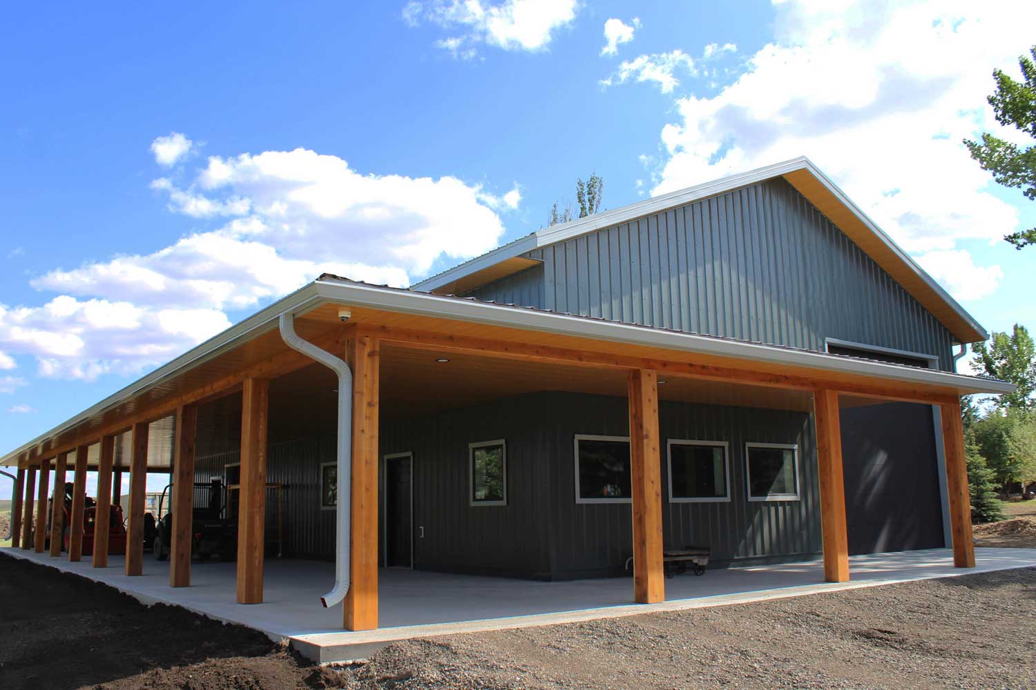 Gunmetal grey siding and Vented Soffit and non-vented soffit in Autumn Woodgrain on a residential work shop