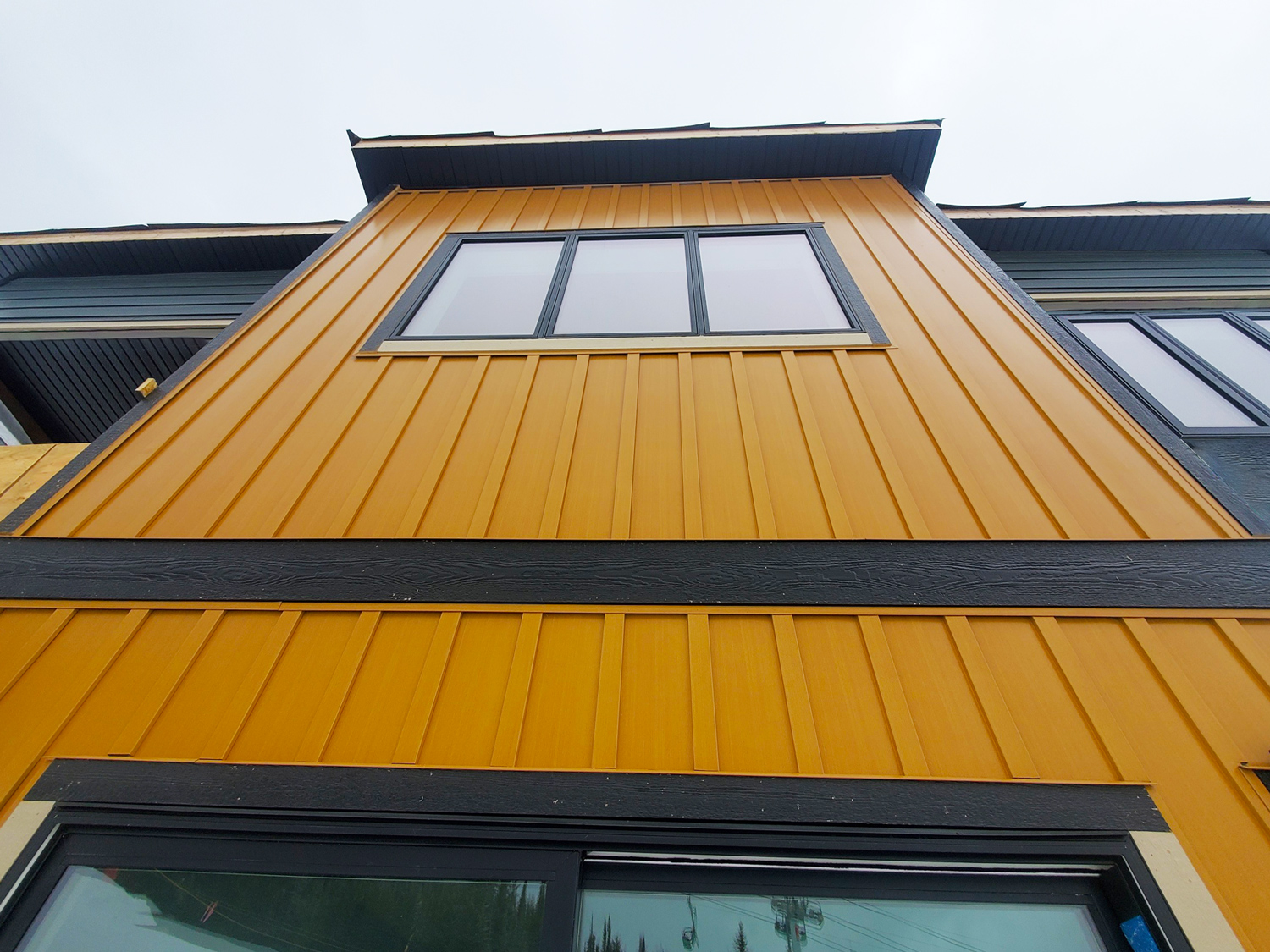 Residential Build with Board and Batten panel in Autumn Woodgrain