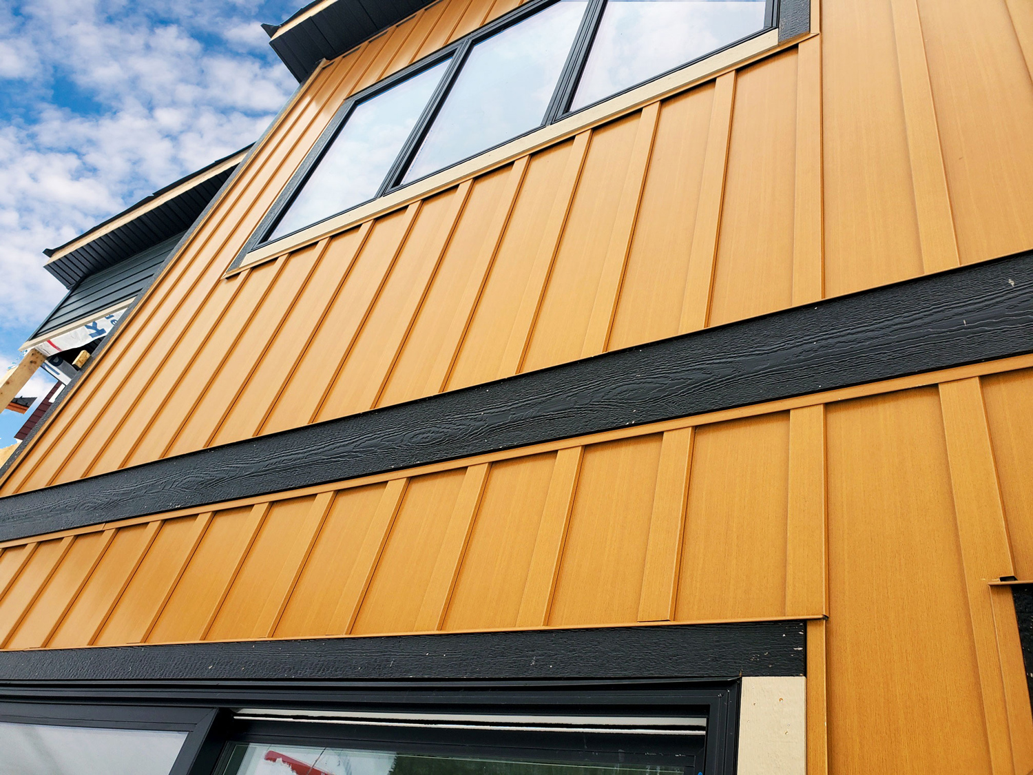 Residential Build with Board and Batten panel in Autumn Woodgrain