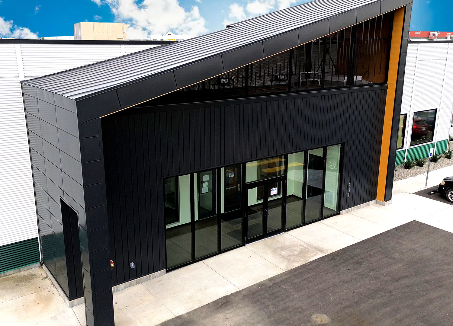 Commercial Building with Expand Modular Panels in Carbon and Interloc 8" in Autumn.