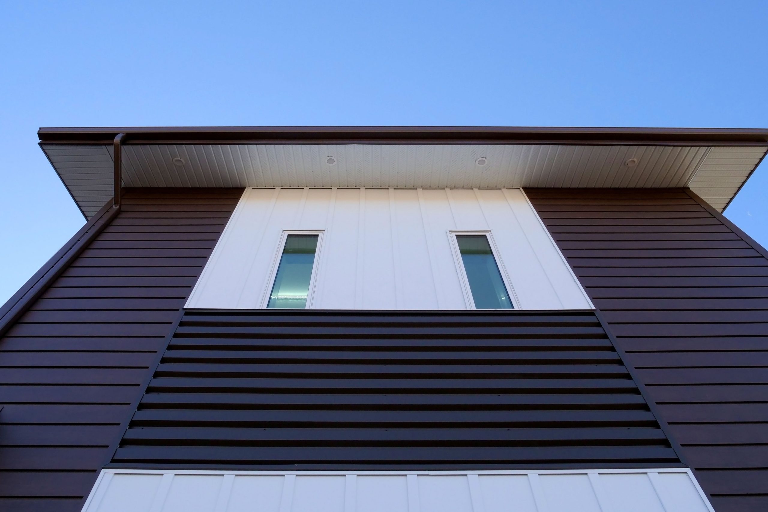 6" Box Rib in Burnished Slate for Lethbridge Pet Hospital. Also includes our Board and Batten panels in Arctic White.