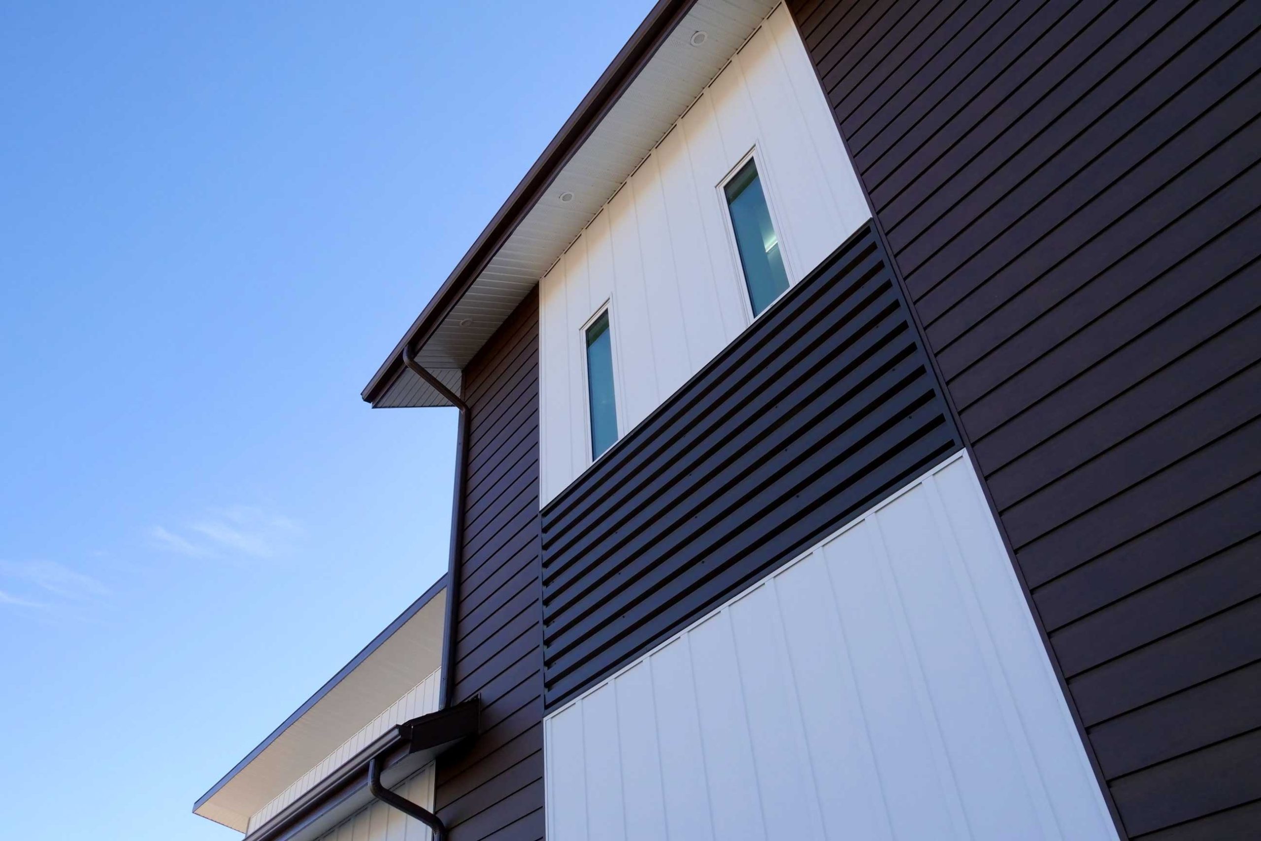 Board & Batten in Arctic White, Box Rib in Burnished Slate, and SlimLine in Dark Walnut Woodgrain