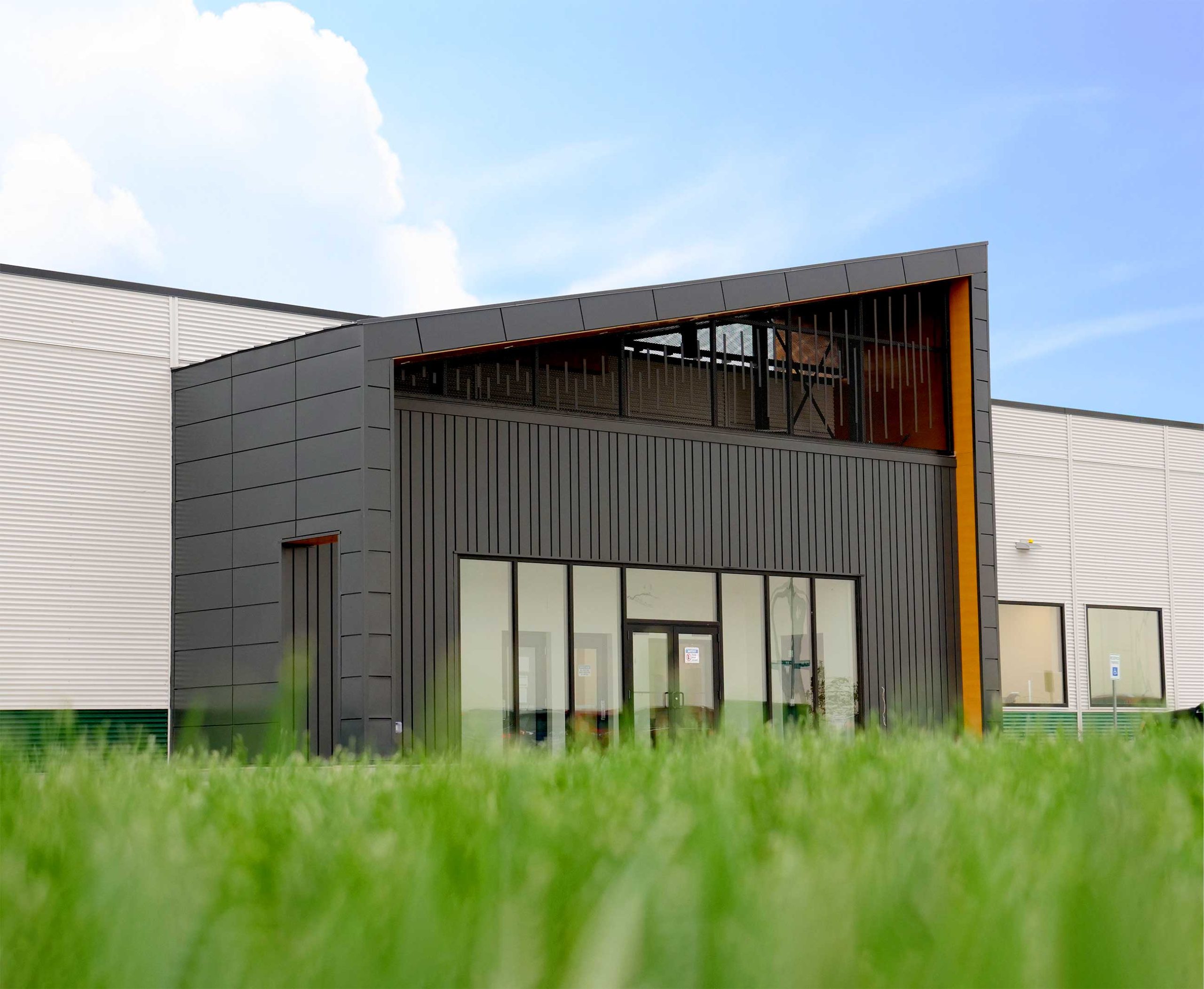Expand Modular Panels in Carbon, Forma Plank in Carbon, and Interloc in Autumn Woodgrain