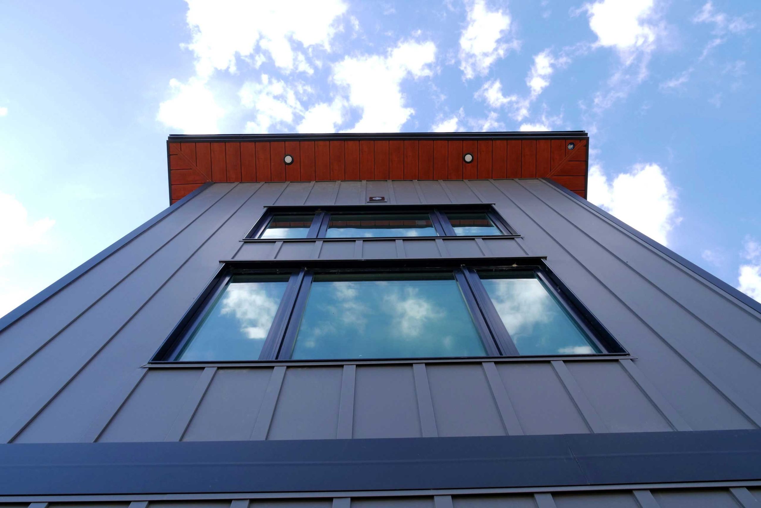 Board & Batten in Graphite with SlimLine Soffit in Frontier Woodgrain