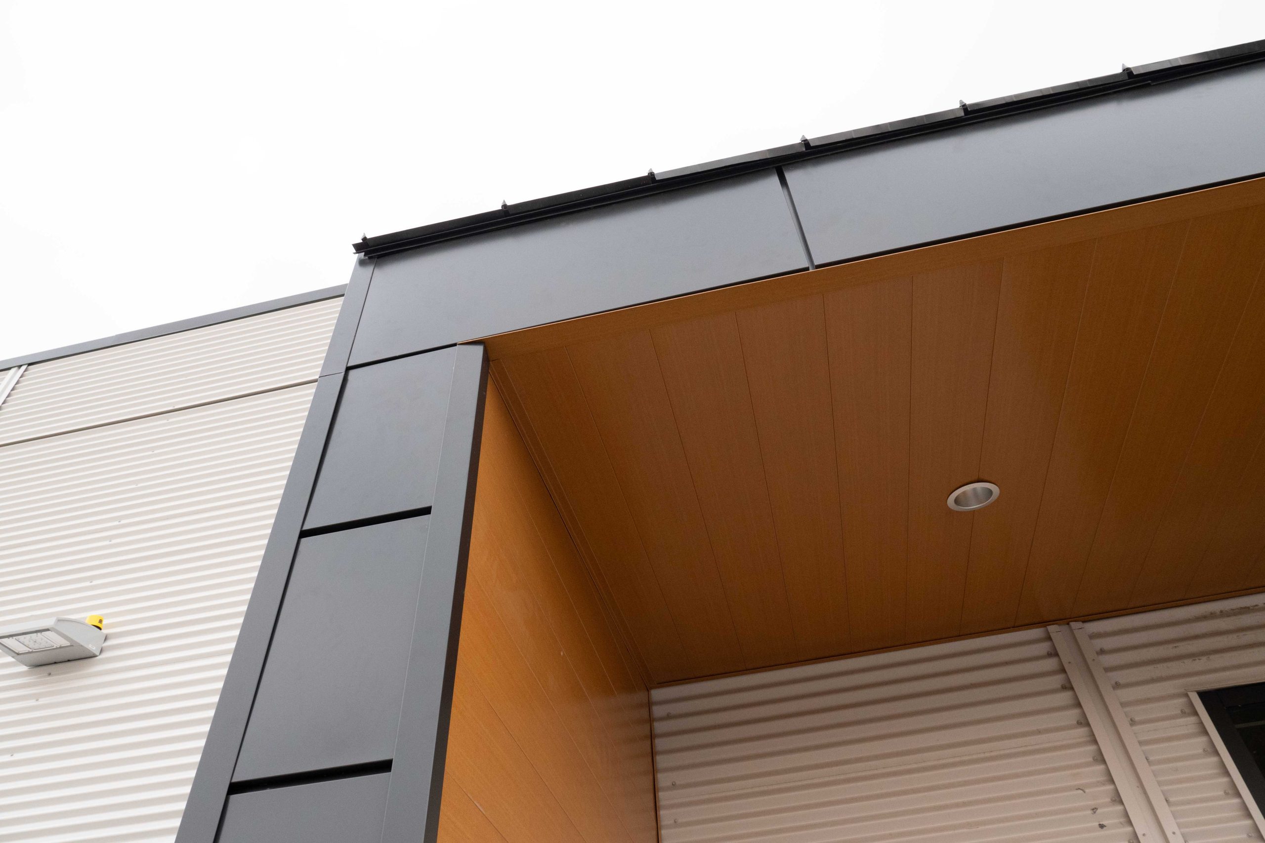 Interloc in Autumn Woodgrain Soffit and Expand Modular in Carbon