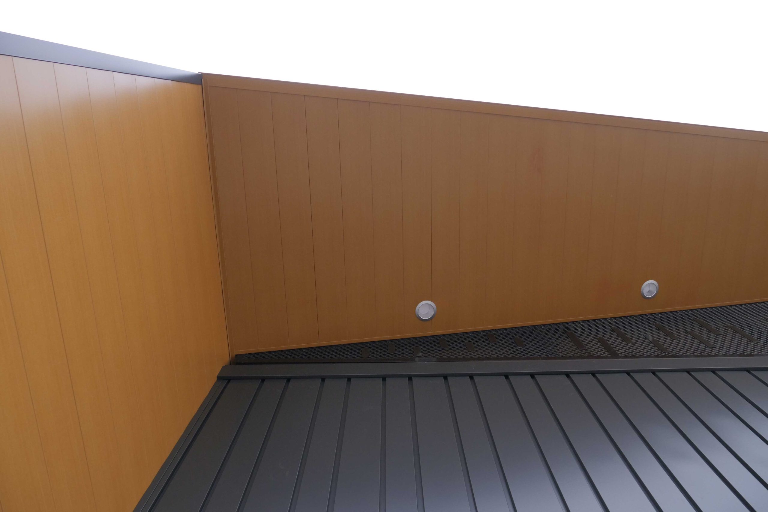 Interloc in Autumn Woodgrain Soffit and Forma Plank in Carbon