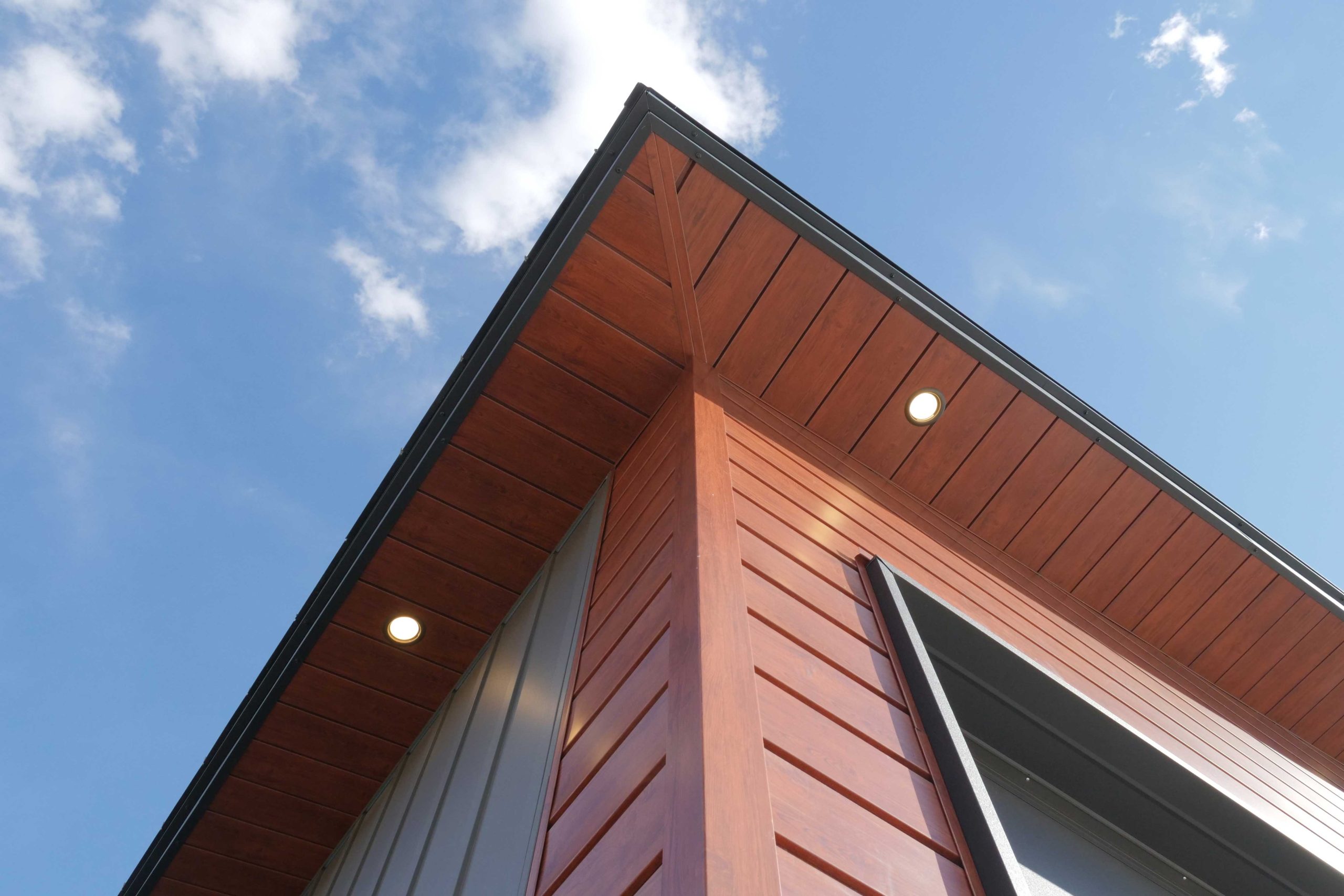 SlimLine Siding and Soffit in Frontier Woodgrain and Board & Batten Graphite